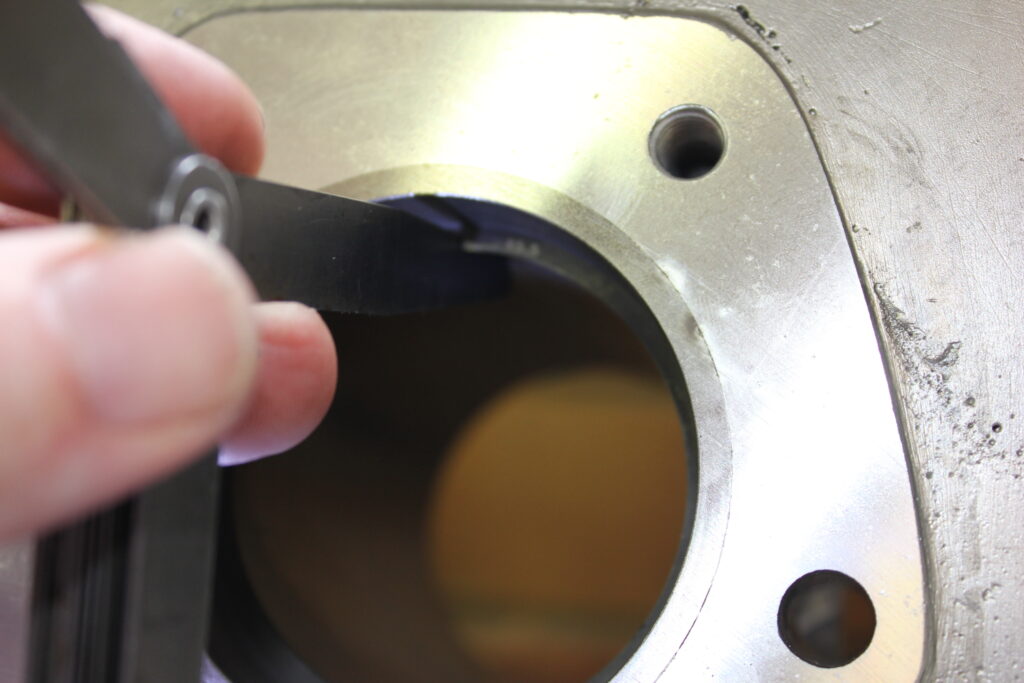 Checking piston ring gap with feeler gauge 